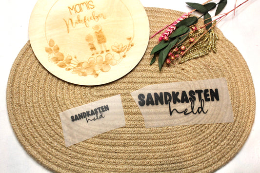 Bügelbild „Sandkasten Held“